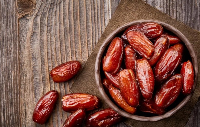 A bowl of dates in order to answer can dogs eat dates?